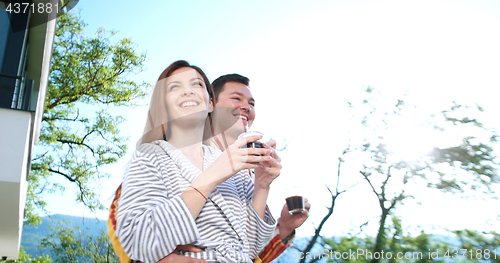 Image of drinking coffee on terrace of villa in the morning