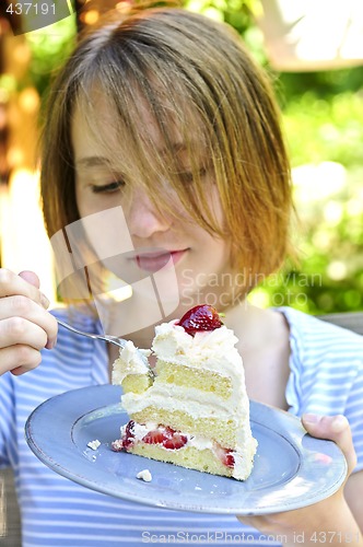 Image of Girl eating a cake