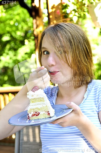 Image of Girl eating a cake