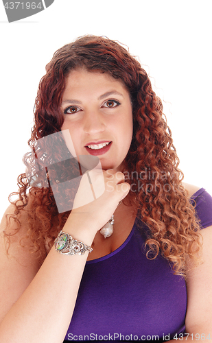 Image of Portrait of beautiful woman with her hand under chin