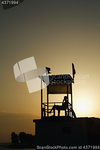 Image of Anonymous person sitting in observation tower