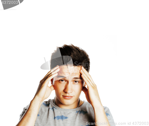 Image of young pretty man with head ache holding hands isolated