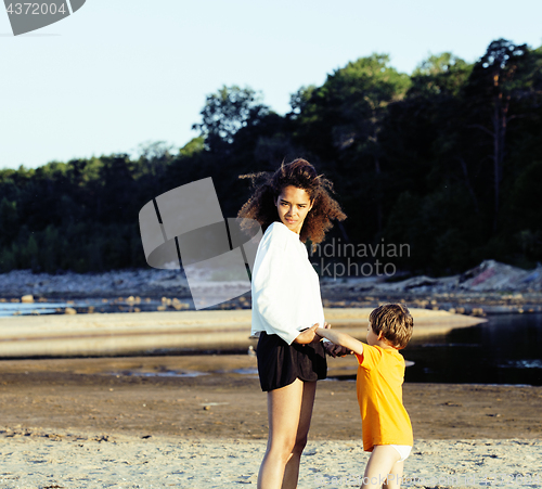 Image of pretty diverse nation and age friends on sea coast having fun, lifestyle people concept on beach vacations close up