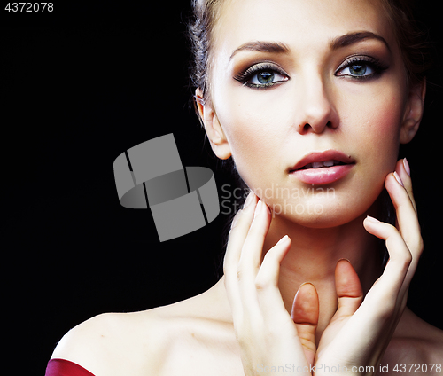 Image of beautiful rich blond woman in elegant dress on black background