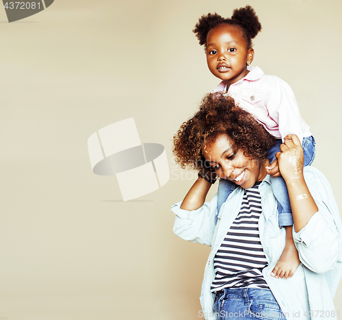 Image of adorable sweet young afro-american mother with cute little daugh