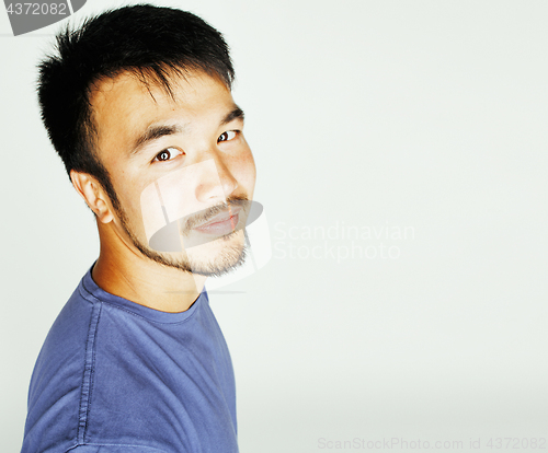 Image of young cute asian man on white background gesturing emotional, po