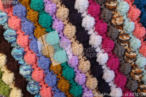 Image of Bobble crochet stitches in diagonal stripes background texture