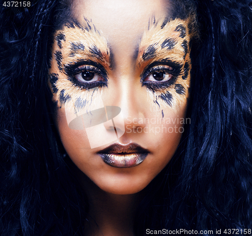 Image of beauty afro girl with cat make up, creative leopard print closeup