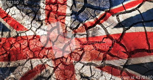 Image of flag of great britain on cracked ground background