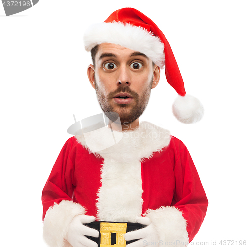 Image of surprised man in santa claus costume over white