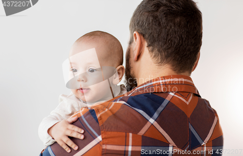 Image of close up of happy little baby boy with father