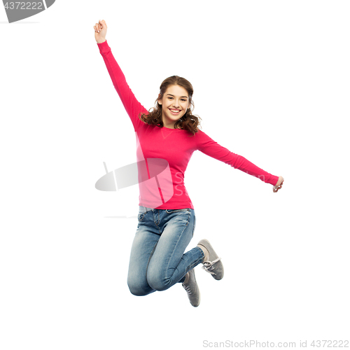 Image of smiling young woman jumping in air