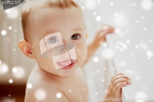 Image of face of happy little baby boy or girl