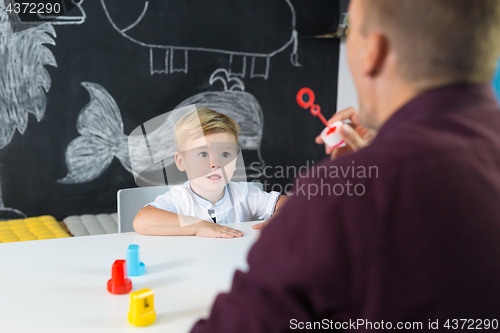 Image of Cute little toddler boy at child therapy session.