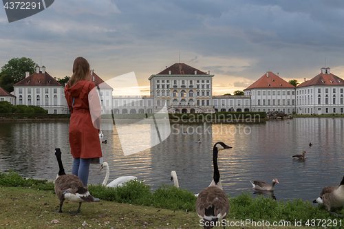 Image of Dramatic post storm sunset scenery of Nymphenburg palace in Munich Germany.