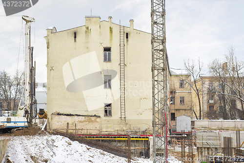 Image of construction site, building and cranes