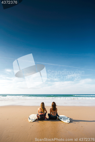 Image of Surfer girls at the beach 