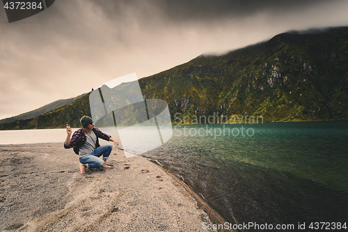 Image of Man throwing a stone