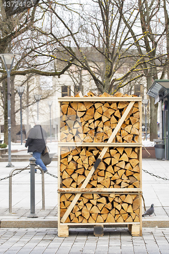 Image of Pile of firewood stacked on the street