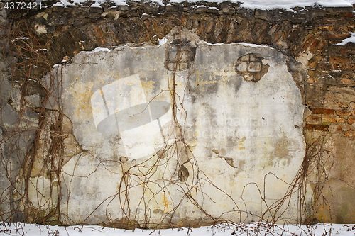 Image of abandoned grunge house, cracked brick stucco wall