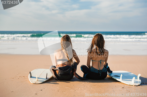 Image of Surfer girls at the beach 