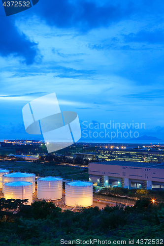 Image of oil tank at night