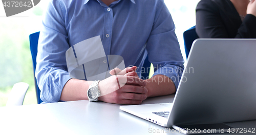 Image of young businessman in startup office