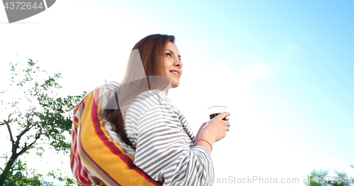 Image of drinking coffee on terrace of villa in the morning