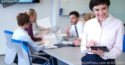 Image of Portrait of  smiling casual businesswoman using tablet  with cow