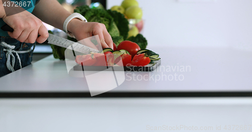 Image of Young Couple In Modern Kitchen  Preparing Food