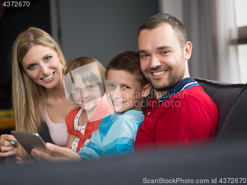 Image of young cuple spending time with kids