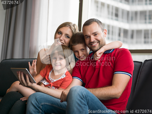 Image of young cuple spending time with kids