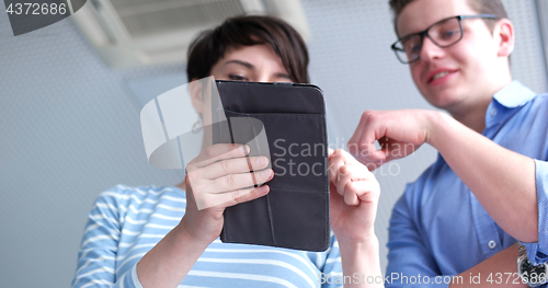 Image of low angle shot of business people using technology