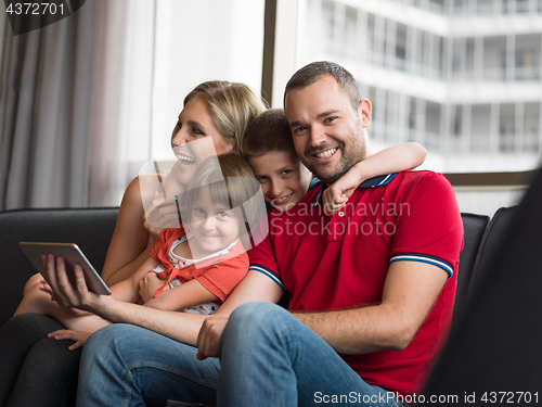 Image of young cuple spending time with kids