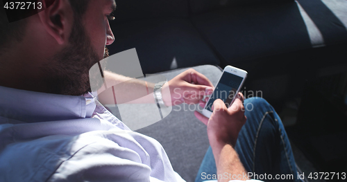 Image of Senior businessman  using cell phone at  stratup office