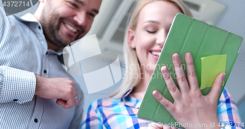 Image of low angle shot of business people using technology