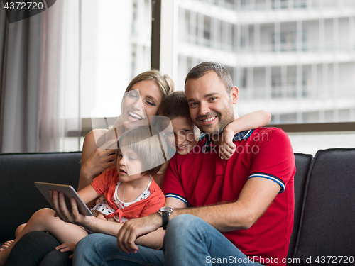 Image of young cuple spending time with kids