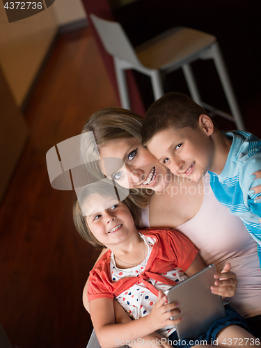 Image of Young Family Using A Tablet To Make Future Plans