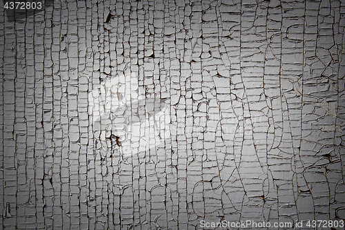 Image of cracked paint on old wood plank