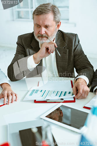 Image of Business man working at table