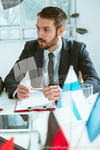 Image of Business man working at table