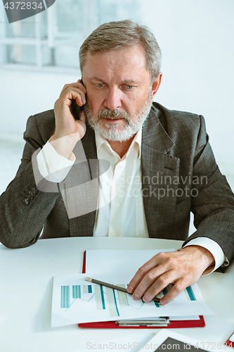 Image of Business man working at table
