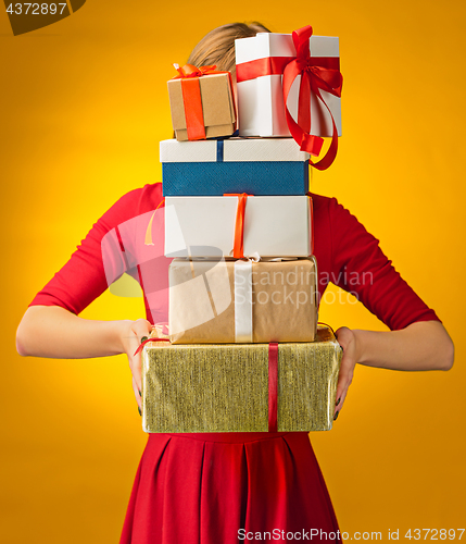 Image of The closeup picture of woman\'s hands with gift box