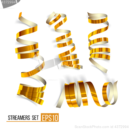 Image of Set of gold curling streamers on white