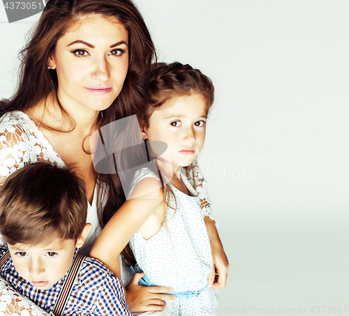 Image of two pretty children kissing their mother happy smiling close up,