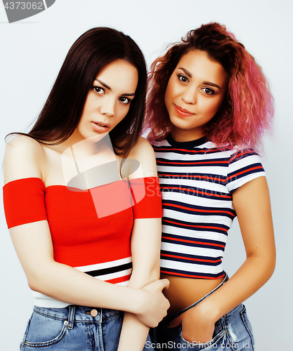 Image of best friends teenage girls together having fun, posing emotional on white background, besties happy smiling, lifestyle people concept, blond and brunette multi nations 