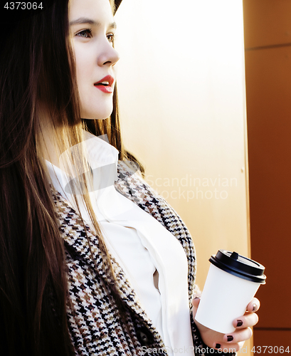 Image of young pretty hipster girl student with coffee cup posing adorable smiling, lifestyle people concept outdoor 