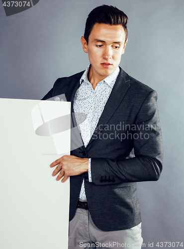 Image of young pretty businessman posing with plate copyspace on white background, lifestyle people concept