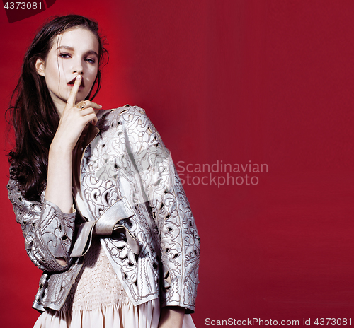 Image of young pretty emitonal posing sexy girl on bright red background, happy smiling lifestyle people concept 