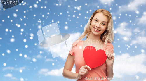 Image of happy woman or teen girl with red heart shape